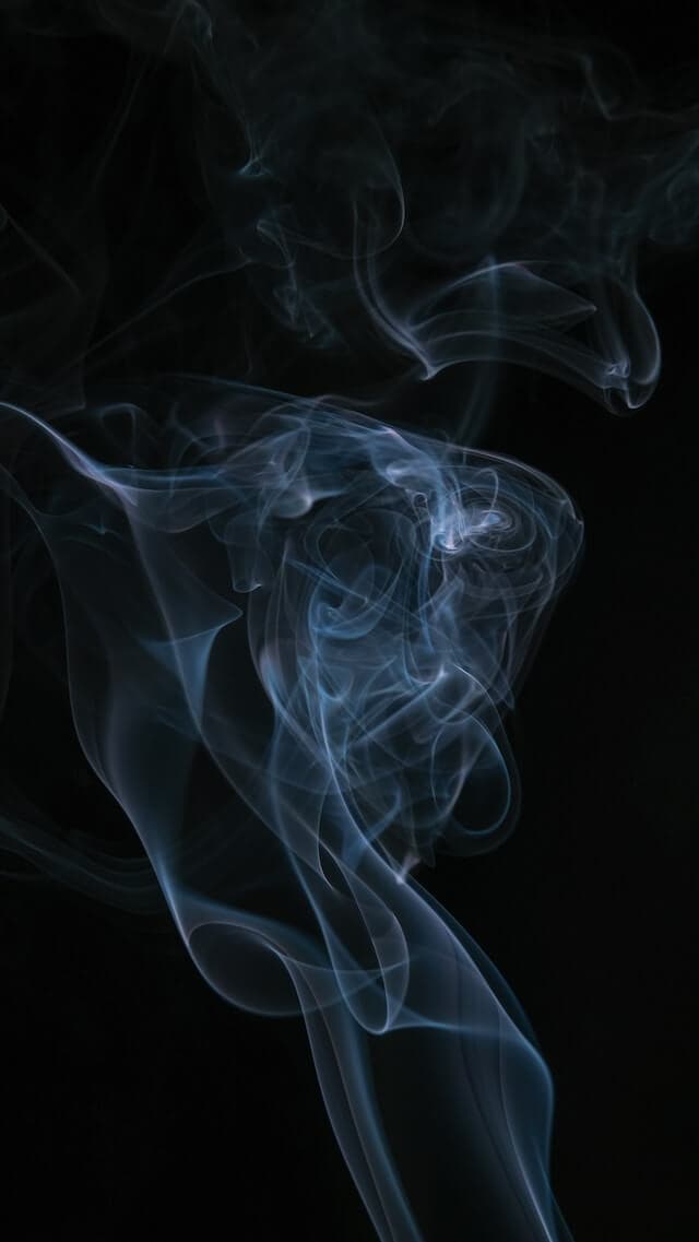 white smoke on black background